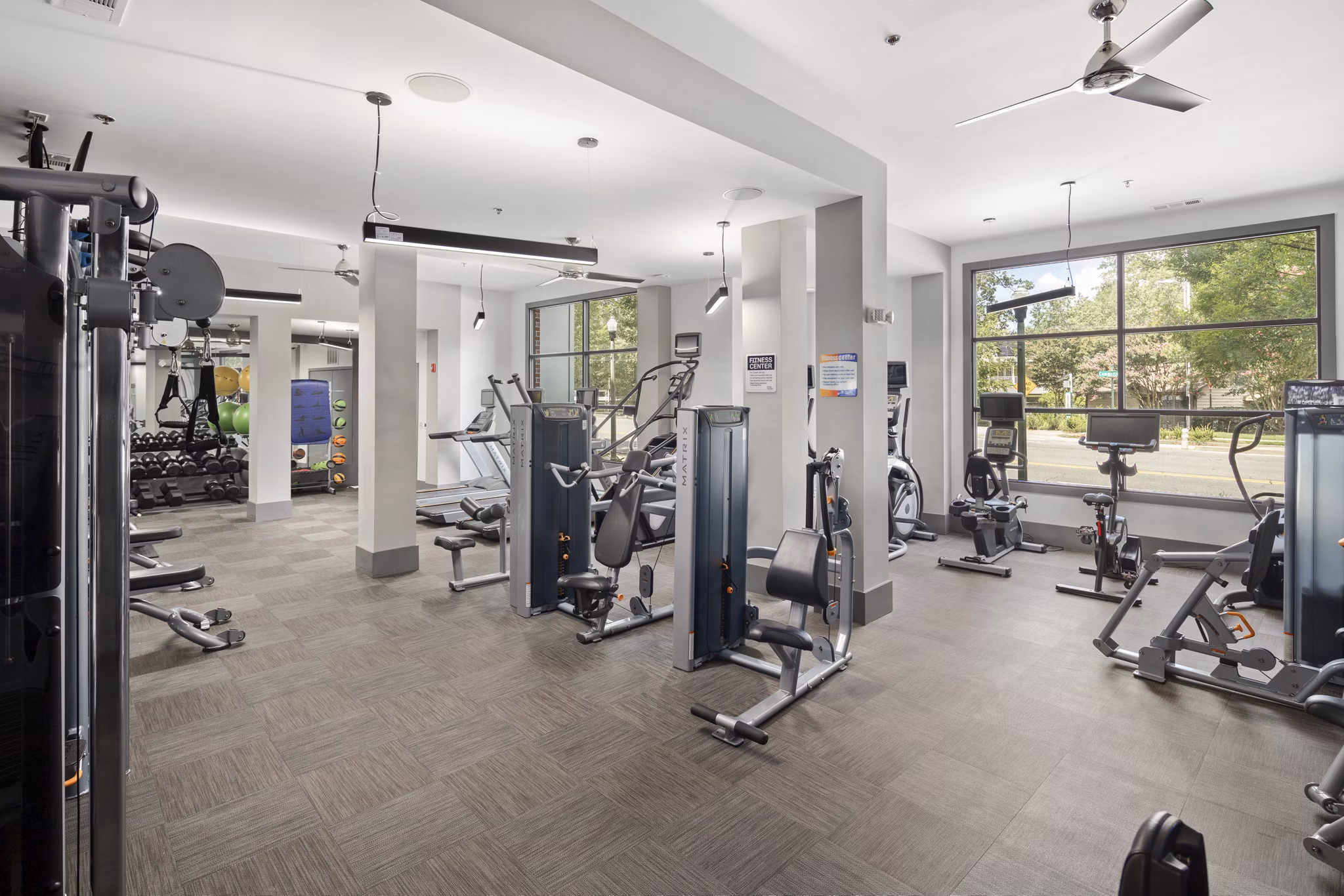State-of-the-art fitness center at 1133 on the Square Apartments offering modern equipment and workout spaces