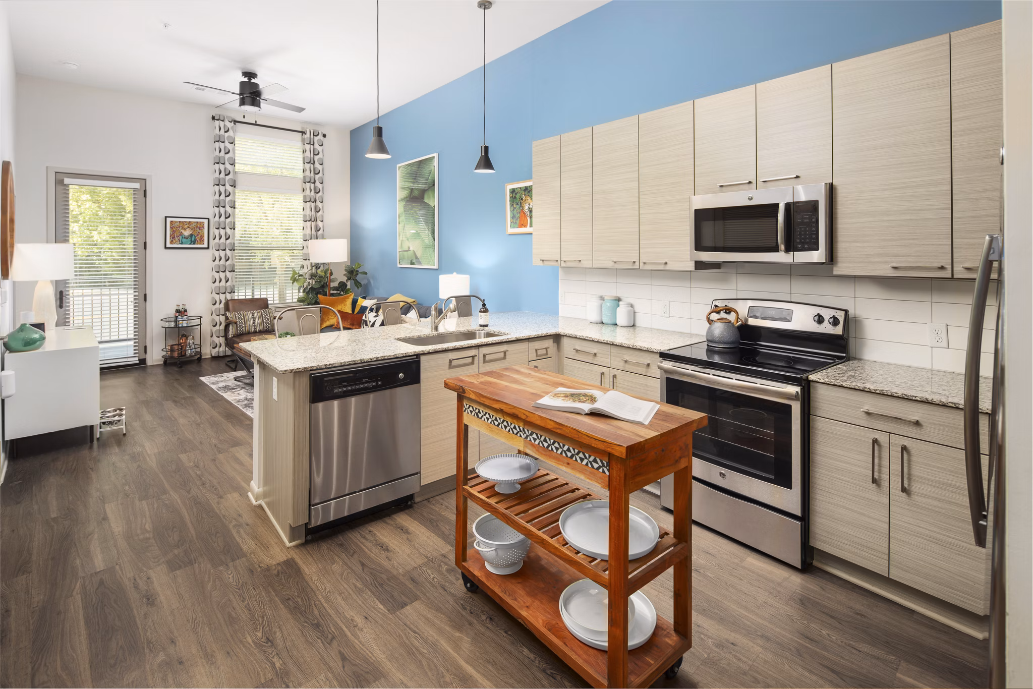Modern kitchen with stainless steel appliances at 1133 on the Square Apartments