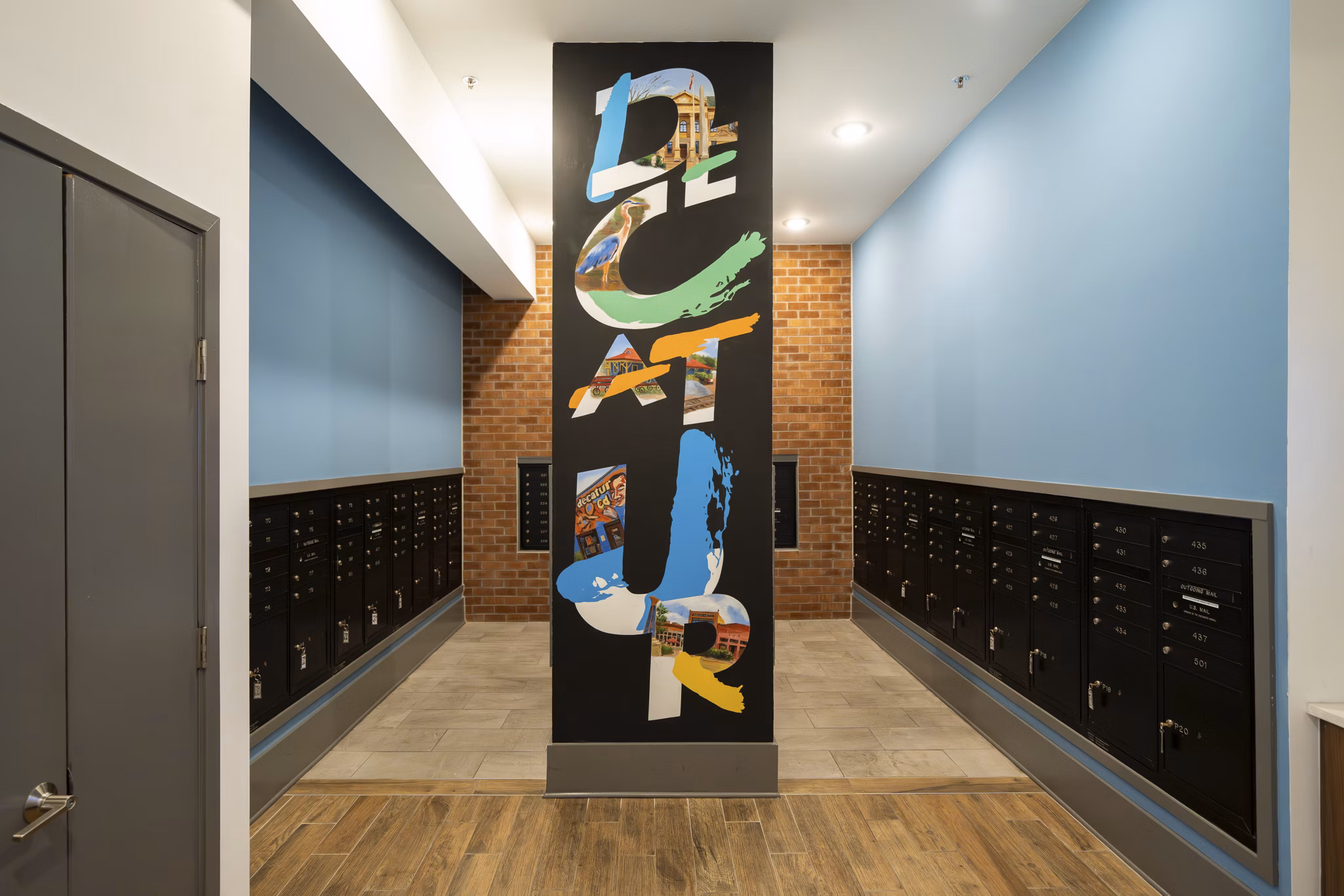 Mail room with secure package lockers at 1133 on the Square Apartments