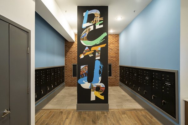 Mail room with secure package lockers at 1133 on the Square Apartments