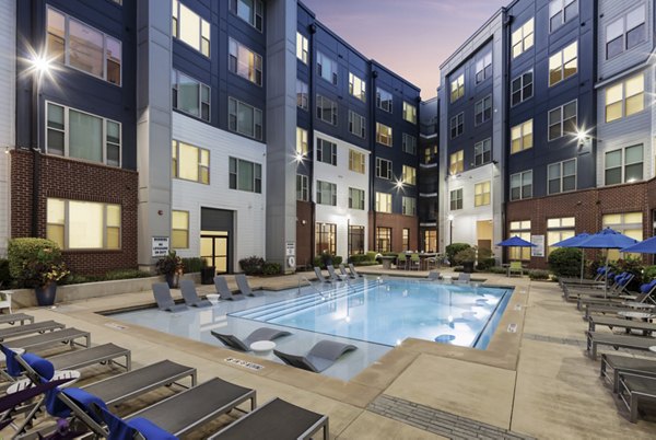 Luxurious rooftop pool at 1133 on the Square Apartments with city views