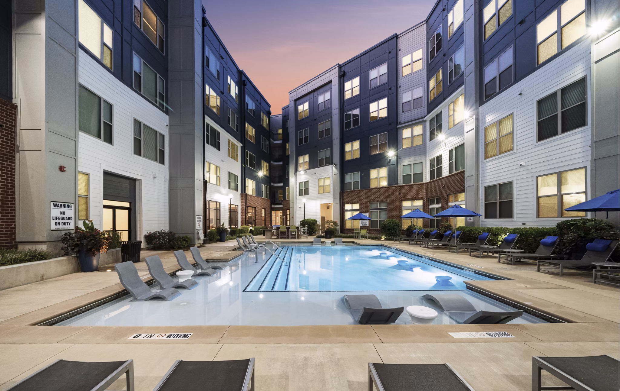 Rooftop pool at 1133 on the Square Apartments offering luxury leisure with city skyline views
