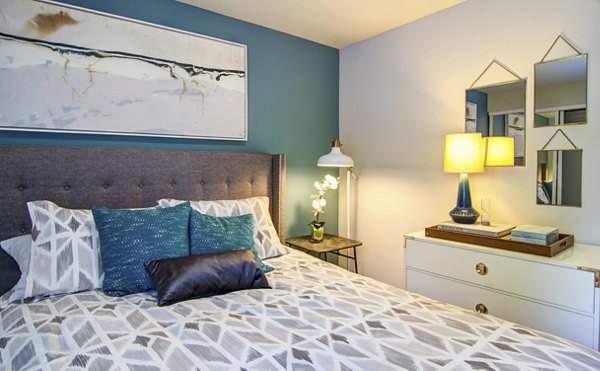 Heatherbrae Commons Apartments: Cozy bedroom featuring modern decor and natural light