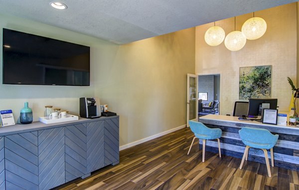 Clubhouse featuring stylish lounge with billiards table at Heatherbrae Commons Apartments, a Greystar luxury property