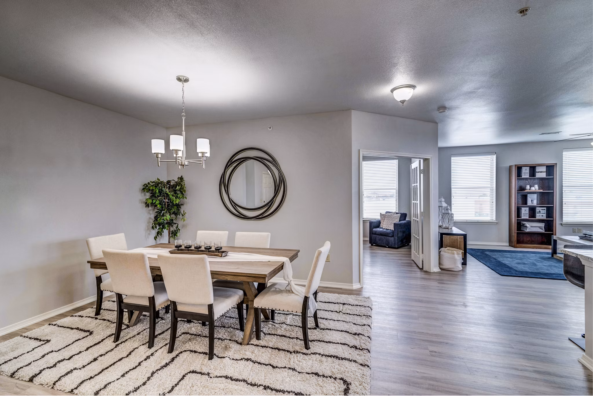 Dining room featuring elegant furniture and modern lighting at Overture Ridgmar Apartments in Fort Worth