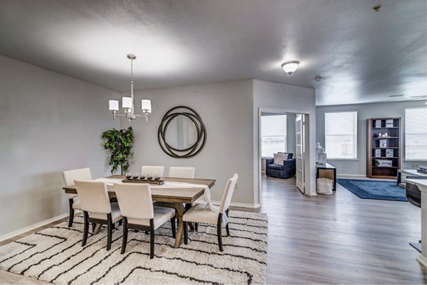 Dining room featuring elegant furniture and modern lighting at Overture Ridgmar Apartments in Fort Worth
