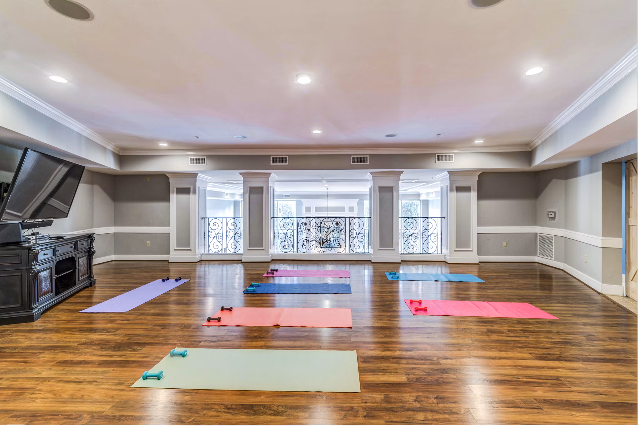 Yoga studio with bamboo floors and natural light at Overture Ridgmar Apartments