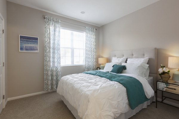 Cozy bedroom with stylish decor at The Retreat at Marlborough luxury apartments
