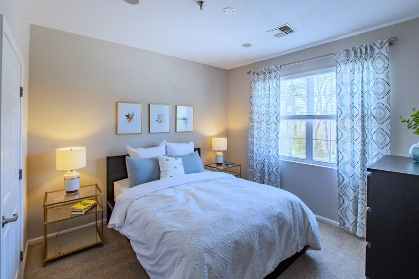 Comfortable bedroom with modern decor at The Retreat at Marlborough luxury apartments