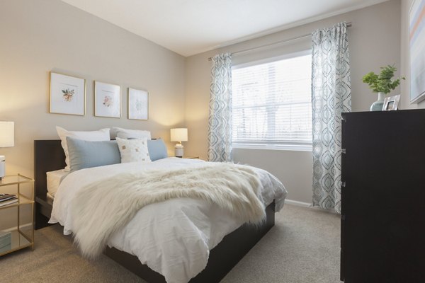 Comfortable bedroom with modern decor at The Retreat at Marlborough luxury apartments