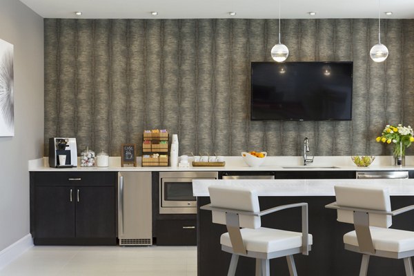 Clubhouse at Heights at Wheeler Hill Apartments: Cozy community space with comfortable seating and modern decor for residents to socialize and relax