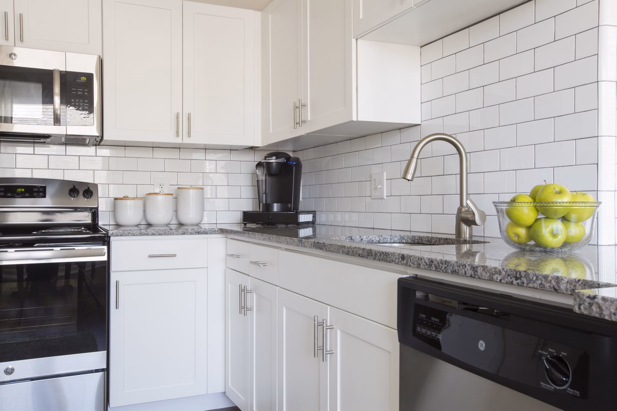 Contemporary kitchen with stainless steel appliances at Heights at Wheeler Hill Apartments