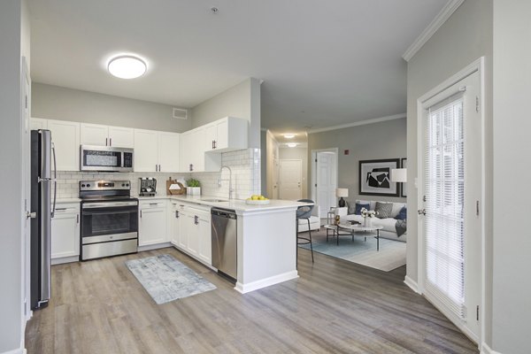 Kitchens featuring stainless steel appliances and granite countertops at The Retreat at Marlborough luxury apartments