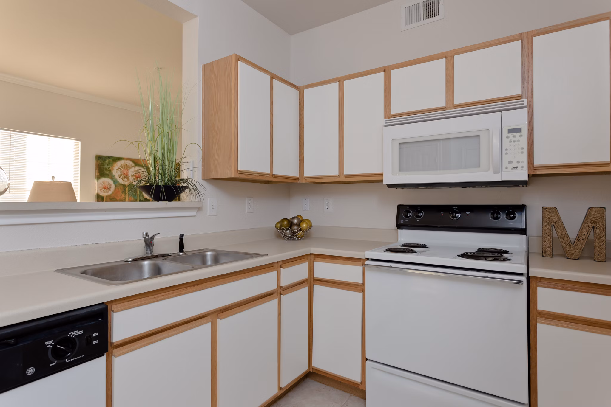 Modern kitchen with sleek countertops and stainless-steel appliances at The Ravinia Apartments