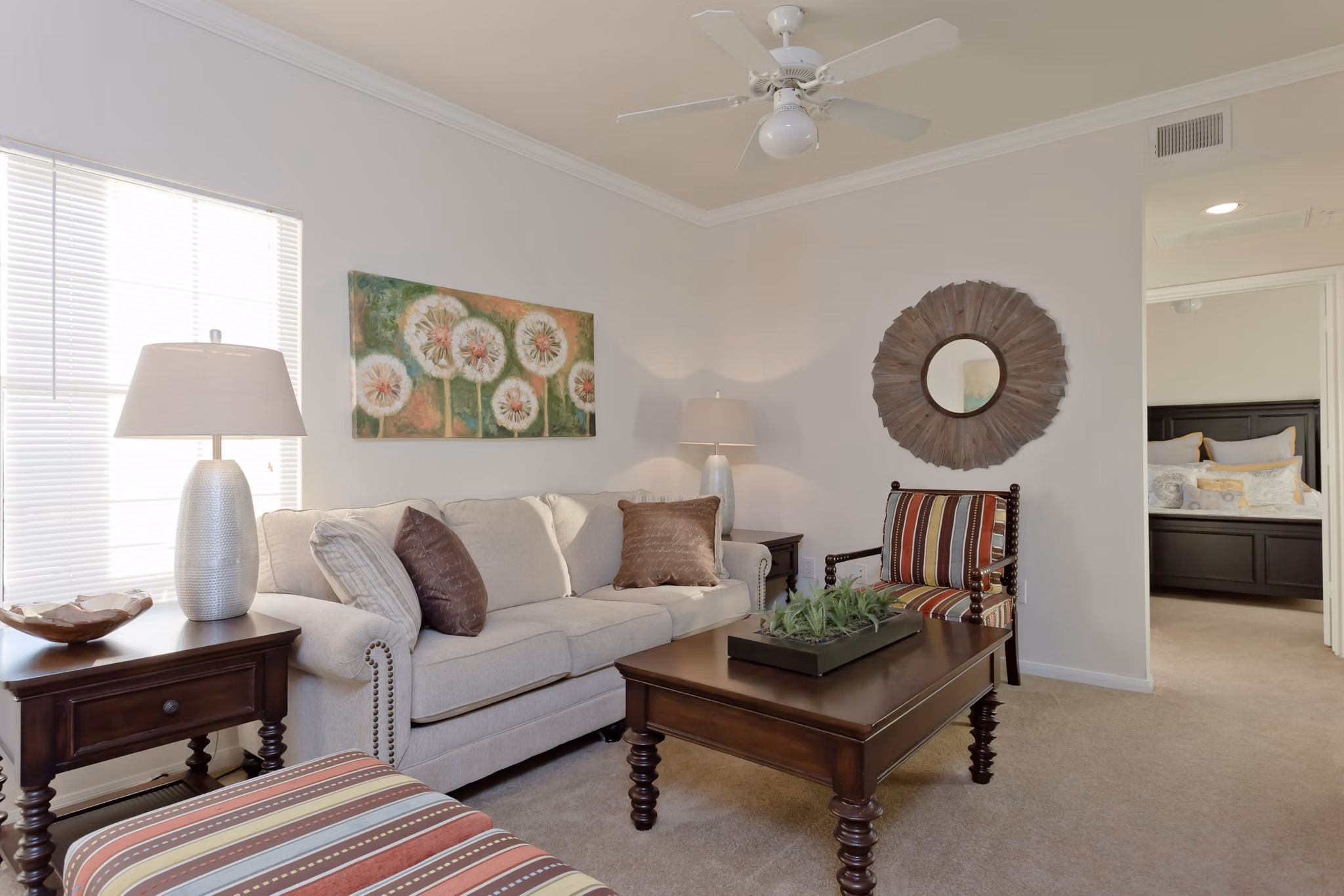 Living room with modern decor and natural light at The Ravinia Apartments, luxury living in a Greystar community