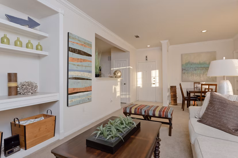 Spacious living room with modern decor at The Ravinia Apartments, luxury Greystar community