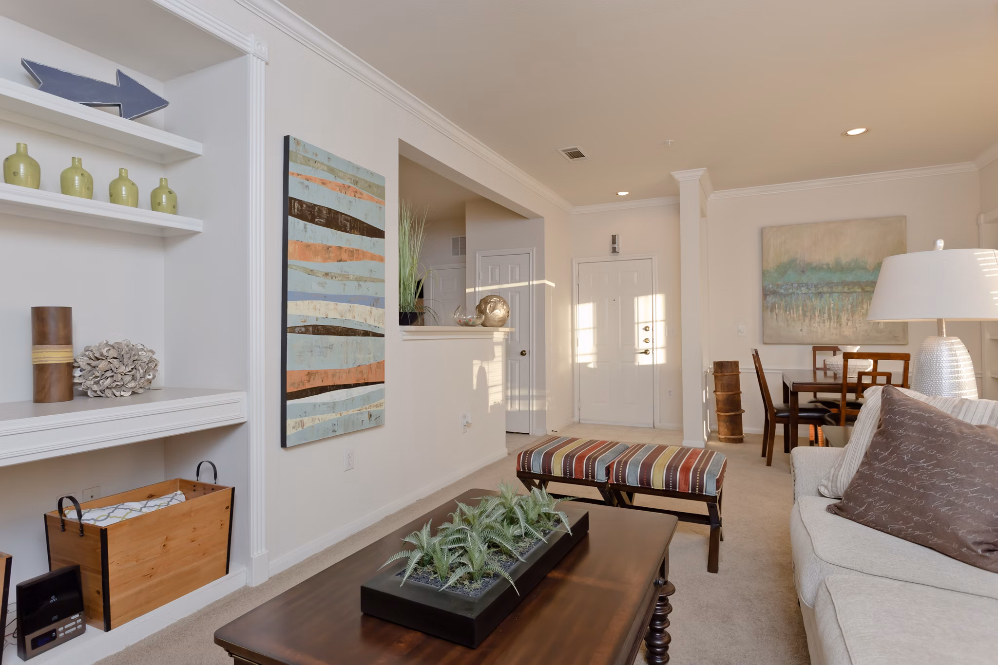 Spacious living room with modern decor at The Ravinia Apartments, luxury Greystar community