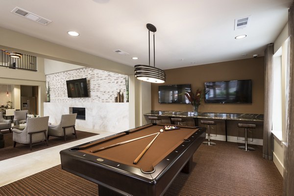 Modern game room with billiards and seating at High Point Uptown Apartments, featuring luxury amenities for residents