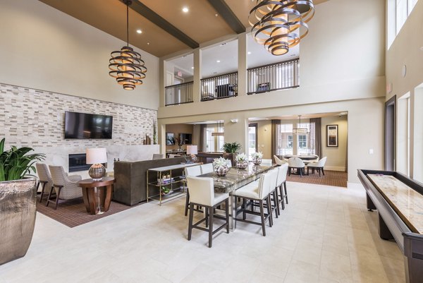 Modern clubhouse with sleek lounge areas at High Point Uptown Apartments, ideal for relaxation and socializing
