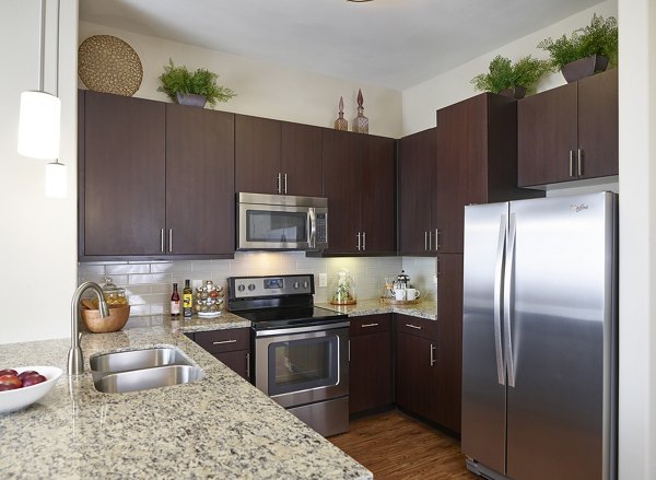 Spacious kitchen with modern appliances in High Point Uptown Apartments