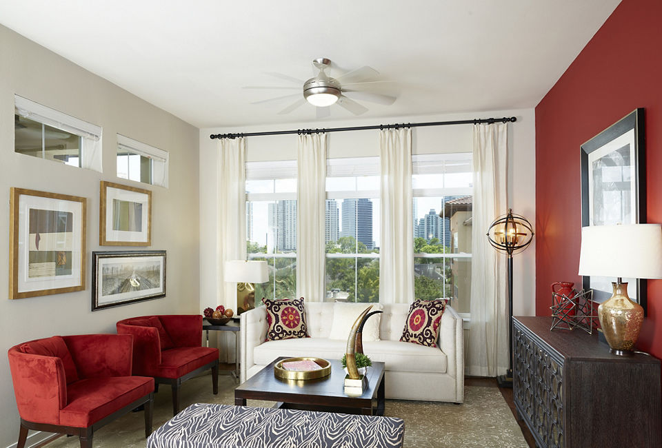 Spacious living room with contemporary decor in High Point Uptown Apartments, featuring modern furnishings and abundant natural light