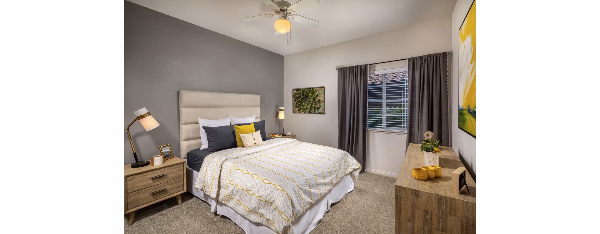 Elegant bedroom with large window and modern decor at The Heights at Chino Hills Apartments