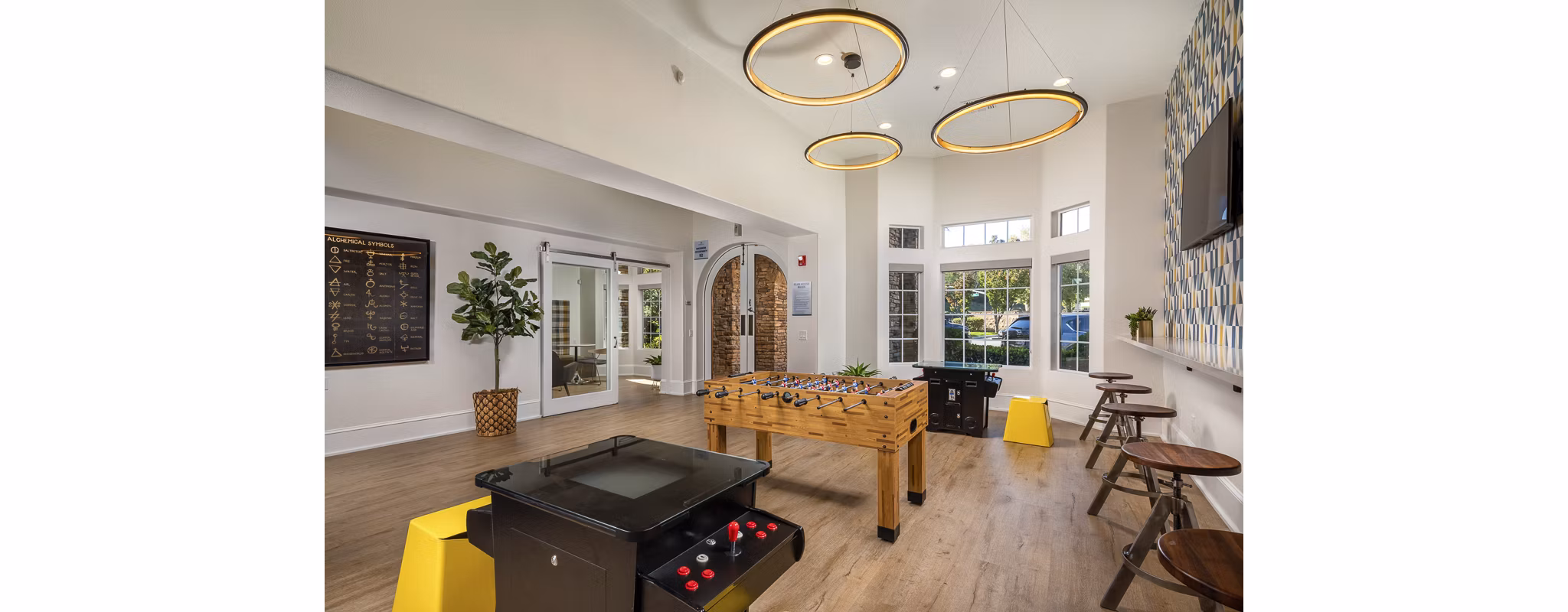Game room with pool table and lounge seating at The Heights at Chino Hills Apartments