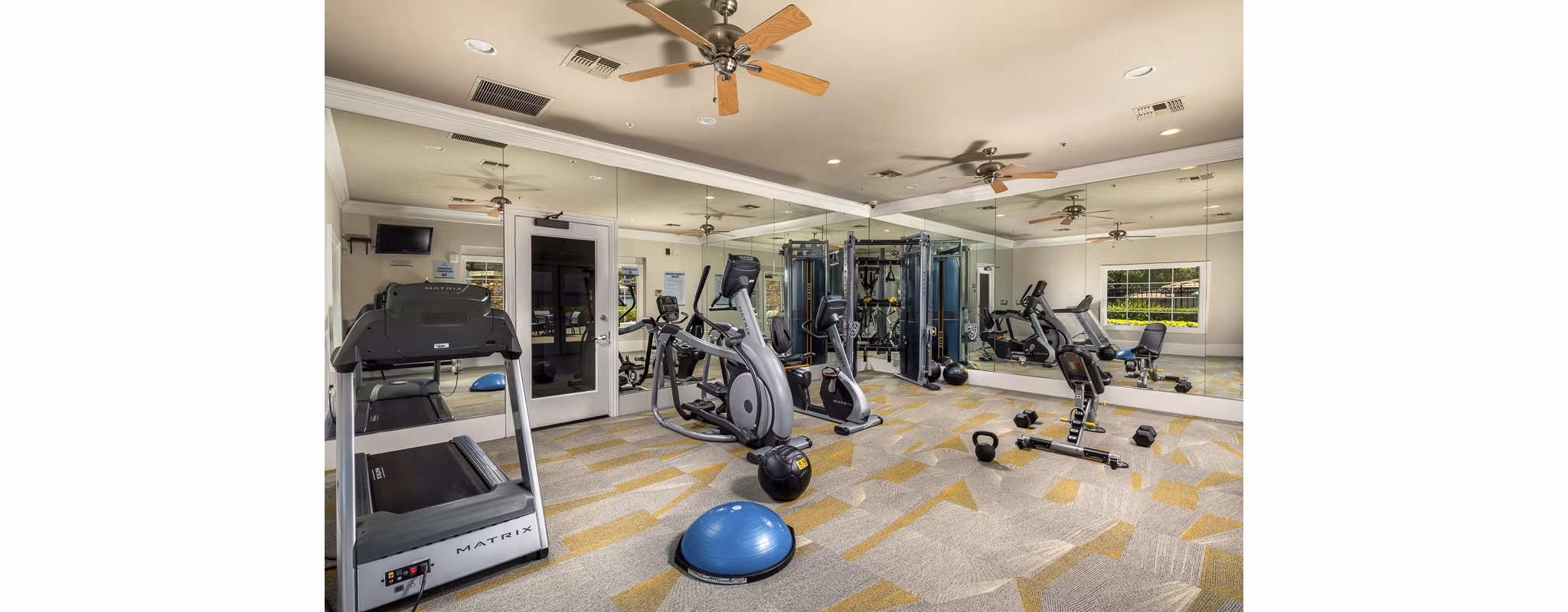 Fitness center featuring modern equipment at The Heights at Chino Hills Apartments