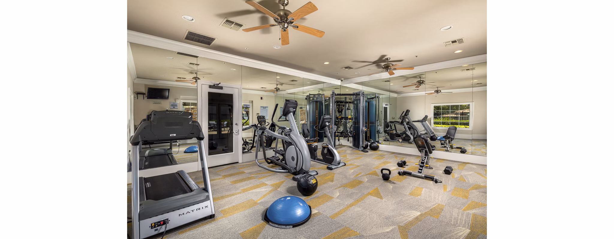 Fitness center featuring modern equipment at The Heights at Chino Hills Apartments