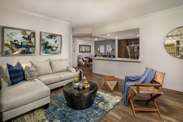 Living room featuring modern decor and ample natural light at The Heights at Chino Hills Apartments