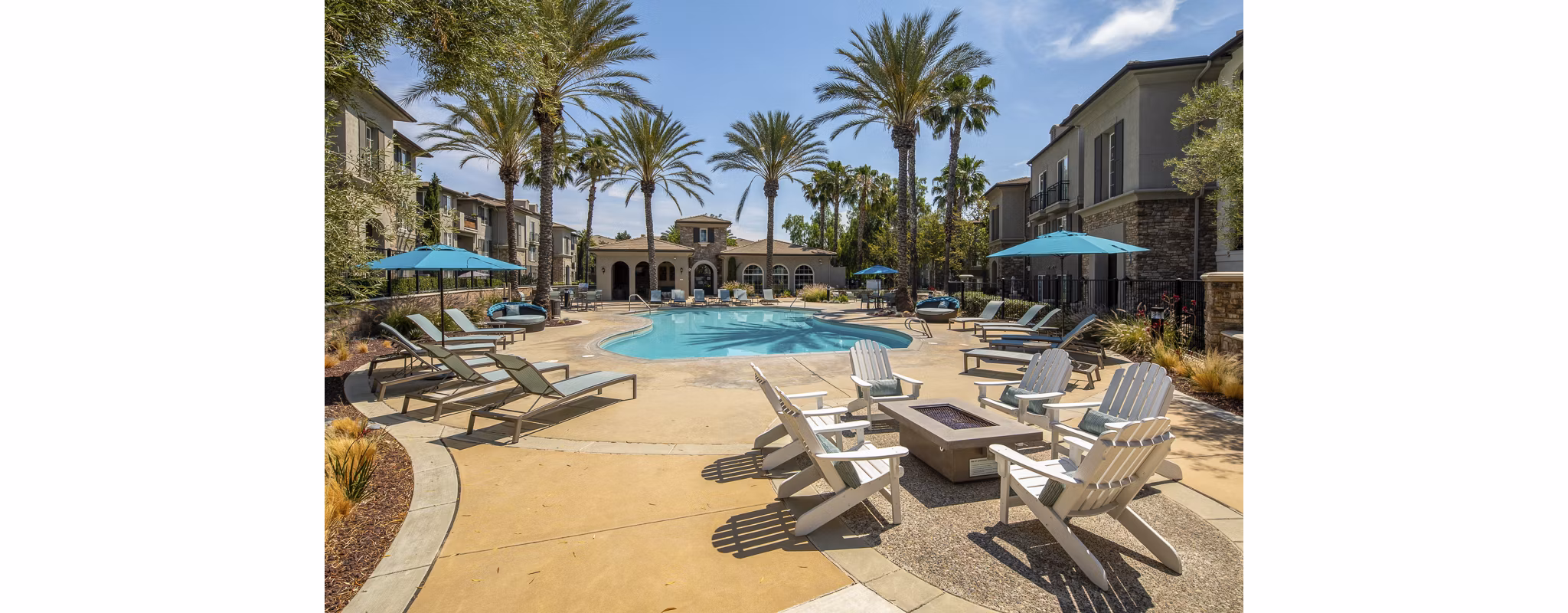 Resort-style pool with sun loungers at The Heights at Chino Hills Apartments