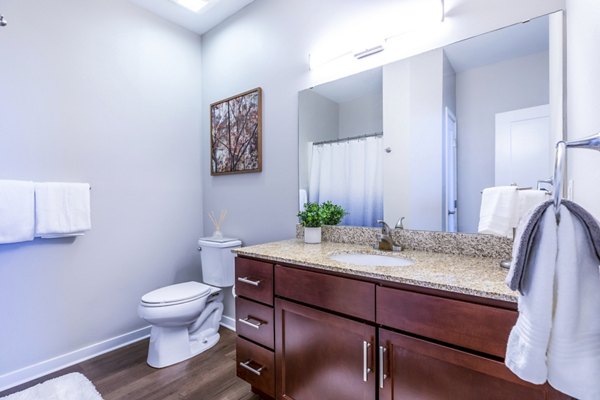 Modern bathroom with sleek fixtures and ample storage in Overture Central Park Apartments, luxury living by Greystar