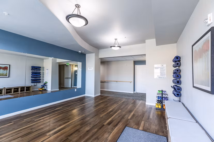 Yoga studio with serene ambiance at Overture Central Park Apartments, offering a peaceful retreat for luxury living
