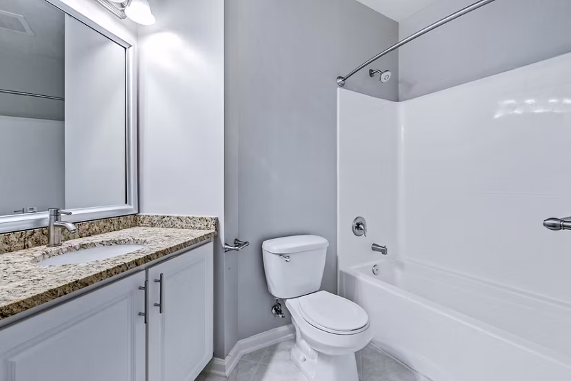 Modern bathroom featuring sleek fixtures and tile design at Rutherford Station Apartments