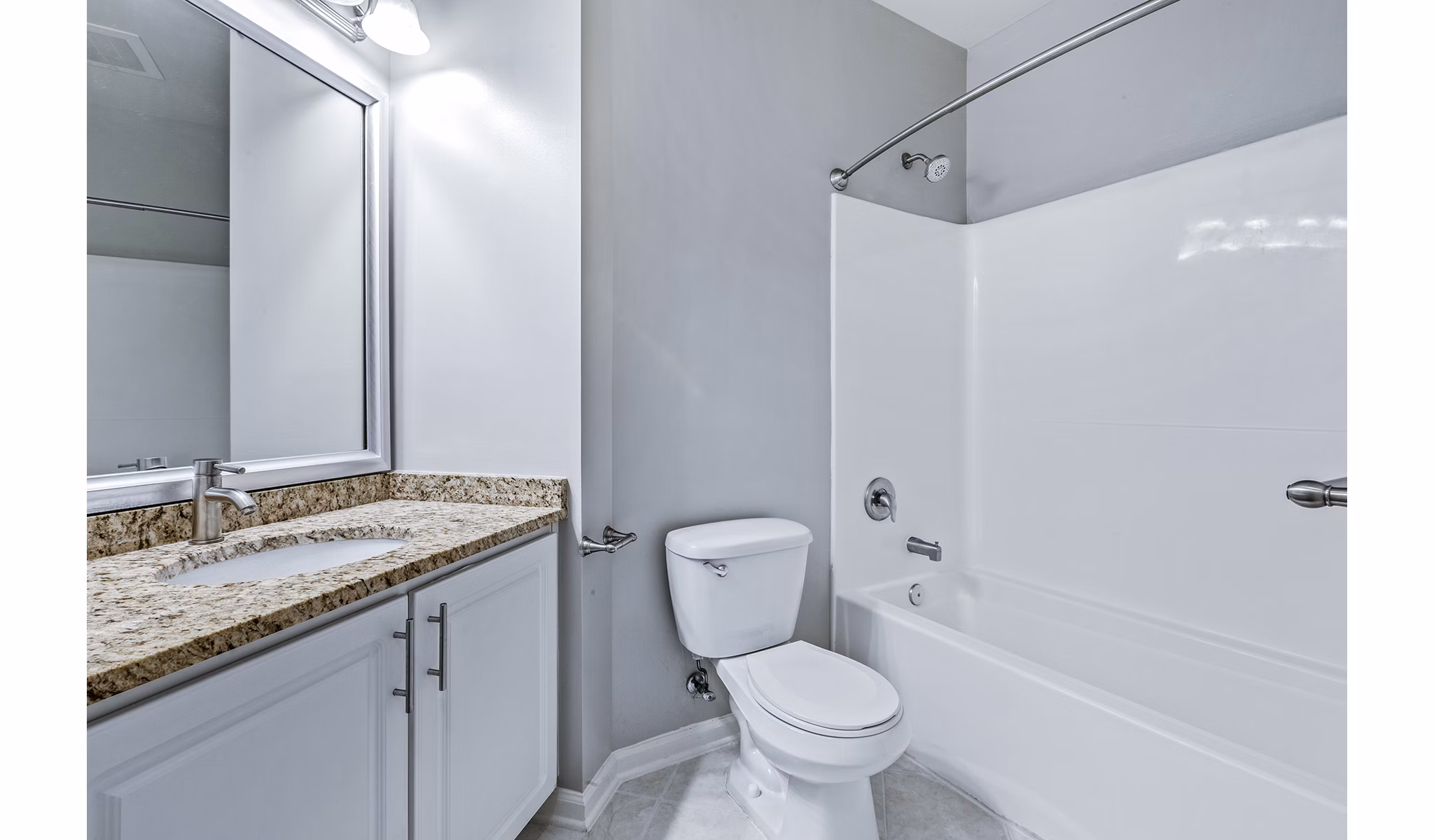 Modern bathroom featuring sleek fixtures and tile design at Rutherford Station Apartments