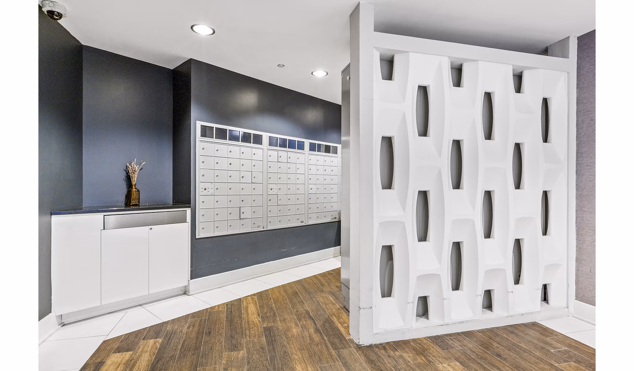 Modern mail room with secure package lockers at Rutherford Station Apartments