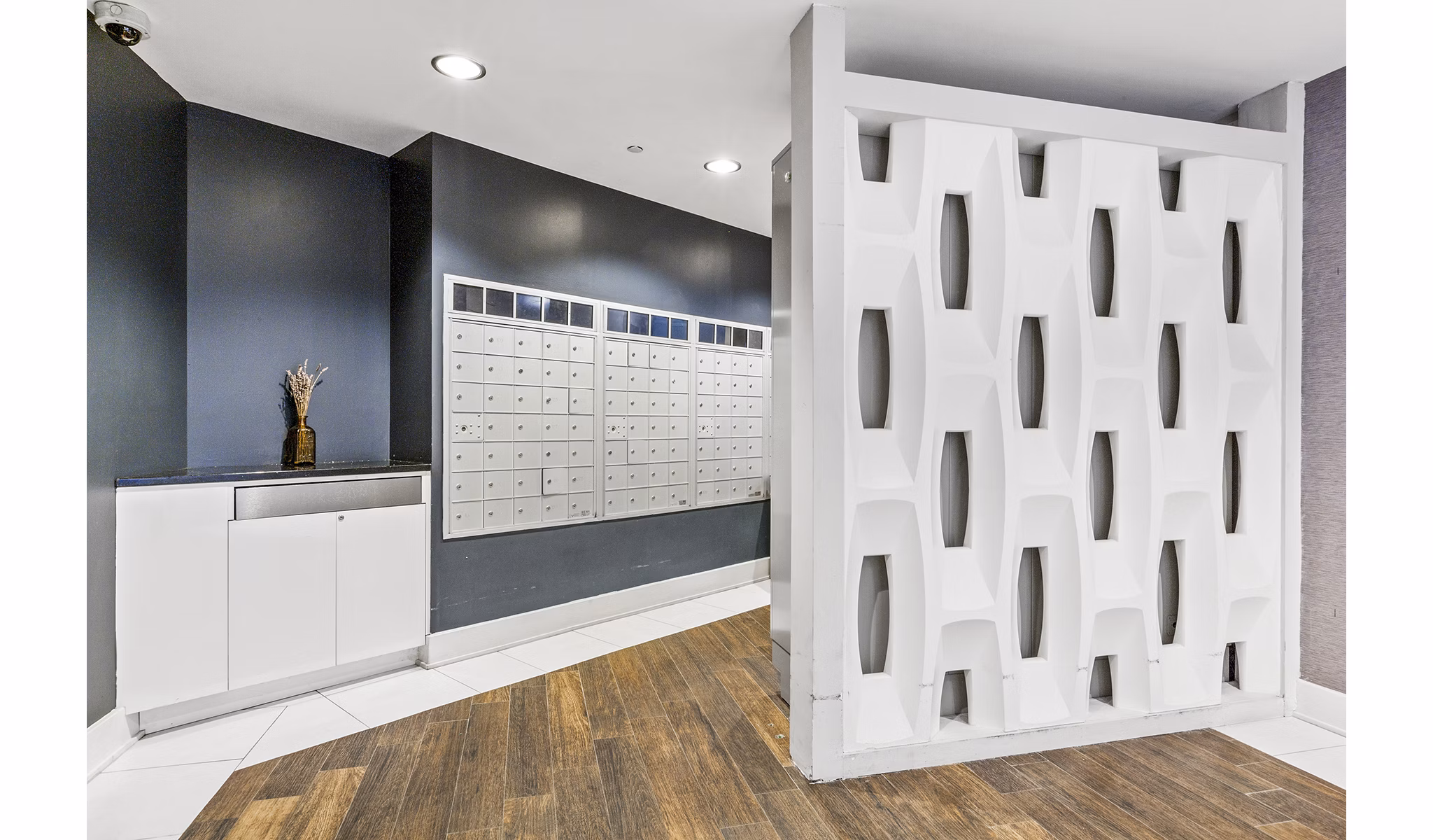 Modern mail room with secure package lockers at Rutherford Station Apartments