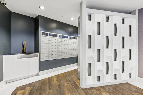 Modern mail room with secure package lockers at Rutherford Station Apartments