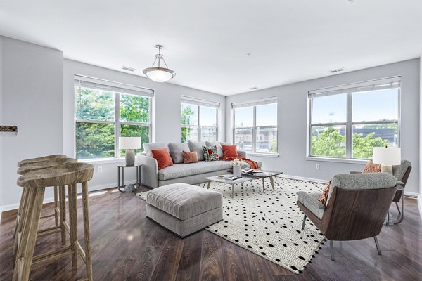 Cozy living room with modern decor at Rutherford Station Apartments
