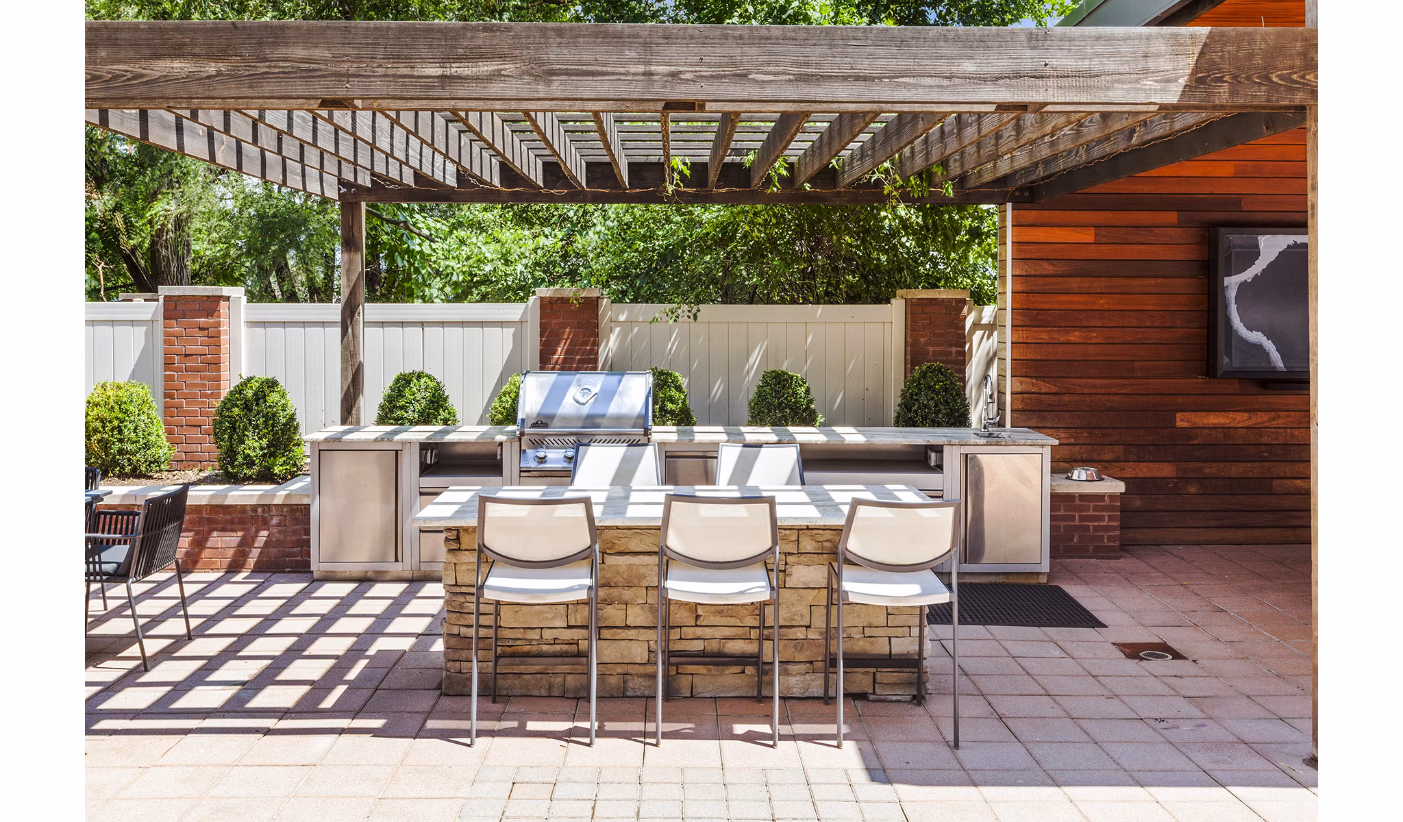 Grill area with modern seating at Rutherford Station Apartments, a luxury community by Greystar