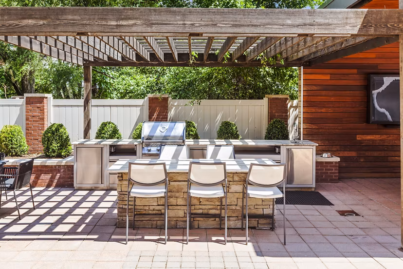 Grill area with modern seating at Rutherford Station Apartments, a luxury community by Greystar