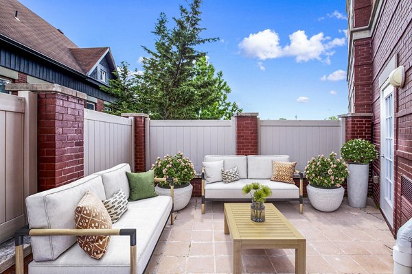 Spacious patio with modern furnishings at Rutherford Station Apartments