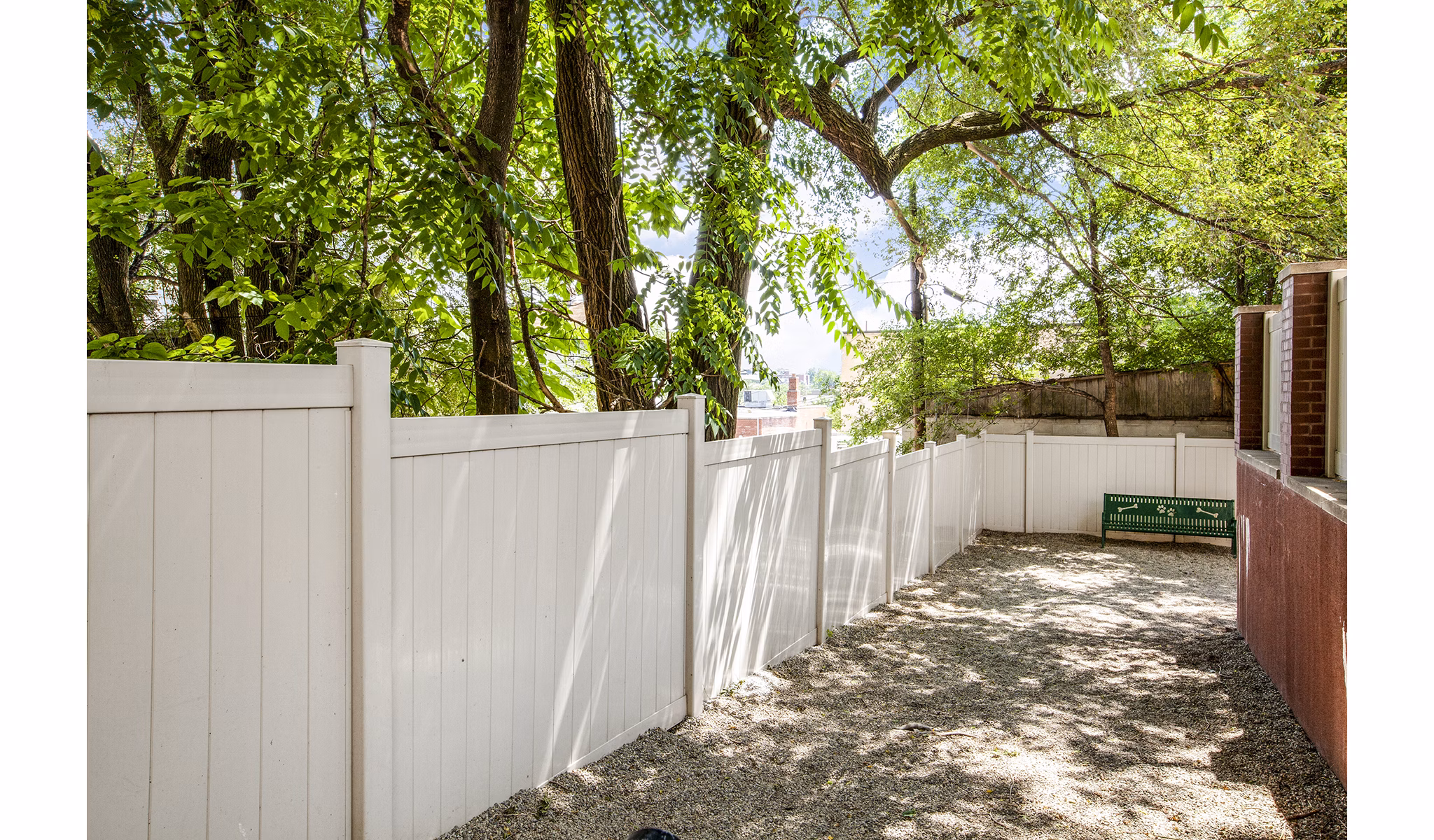 Spacious dog park with agility equipment at Rutherford Station Apartments, offering outdoor activities for pet-friendly living