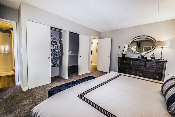 Spacious bedroom with natural lighting and modern decor at Avana Weymouth Apartments