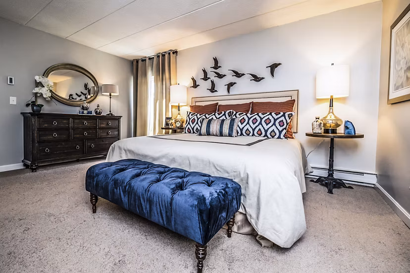 Cozy bedroom with modern design elements at Avana Weymouth Apartments
