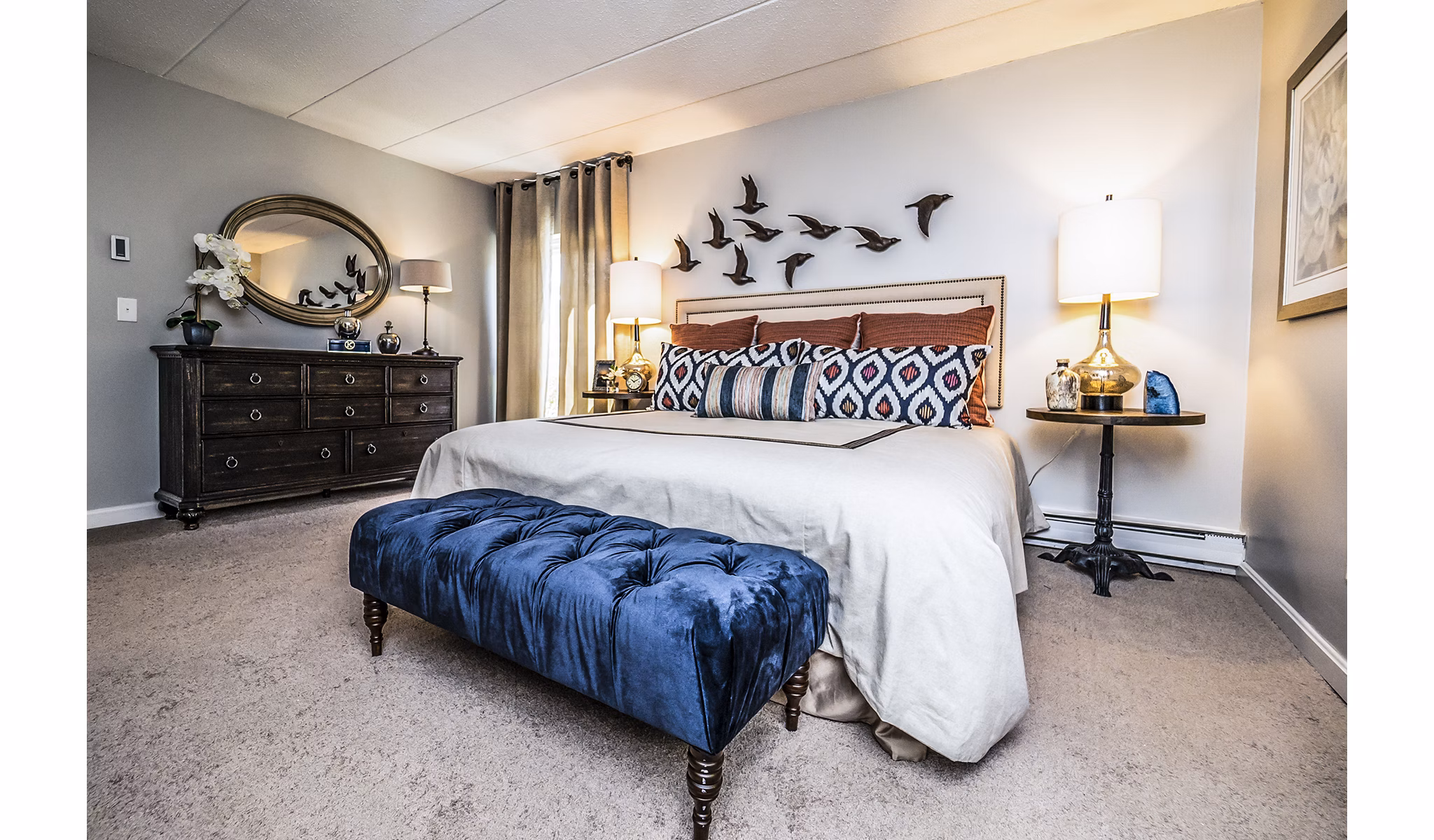 Cozy bedroom with modern design elements at Avana Weymouth Apartments
