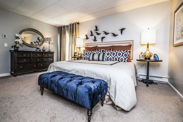 Cozy bedroom with modern design elements at Avana Weymouth Apartments