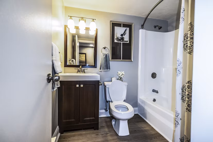Modern bathroom with sleek fixtures and granite countertops at Avana Weymouth Apartments