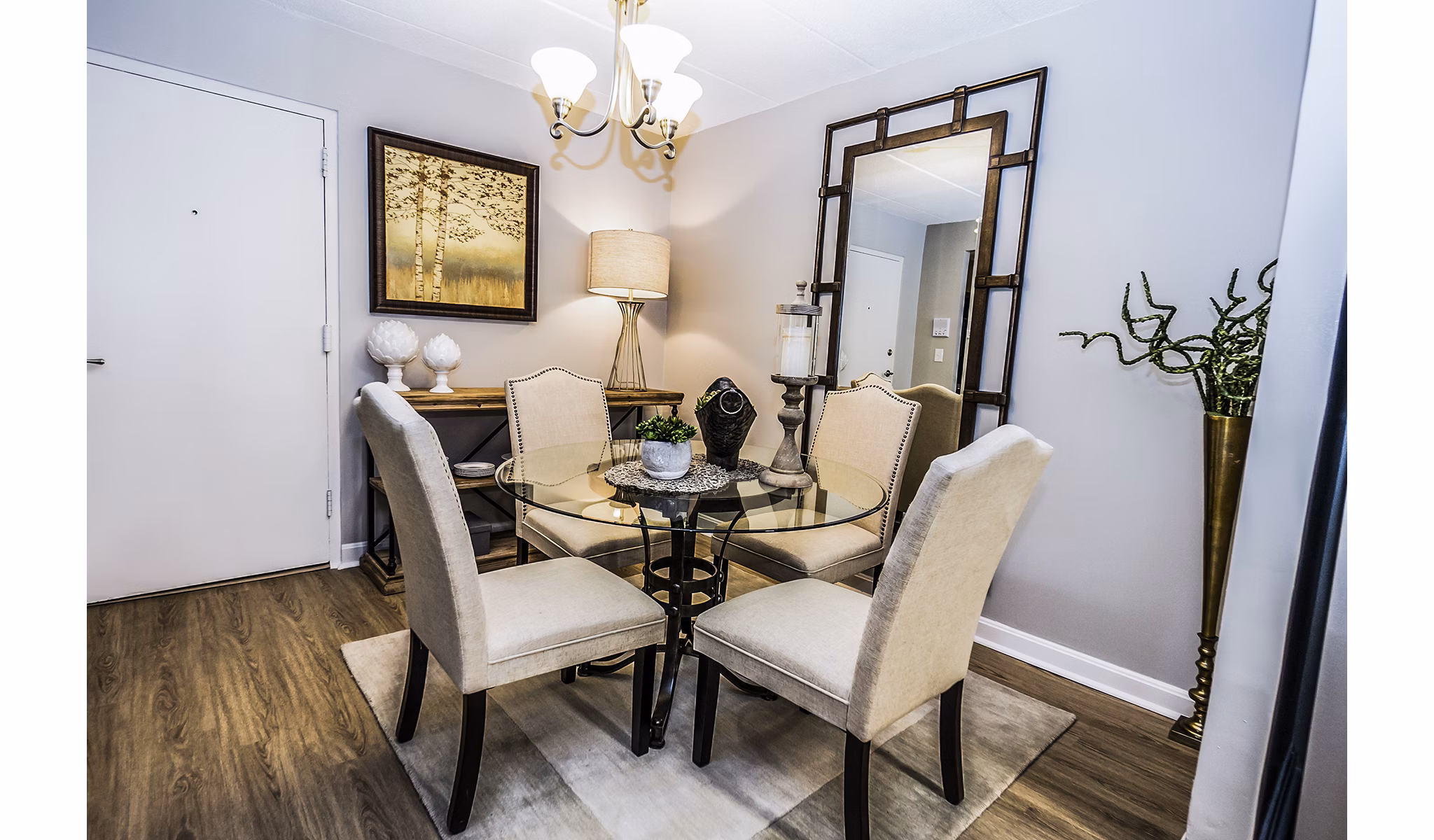 Dining room featuring modern decor and large windows at Avana Weymouth Apartments