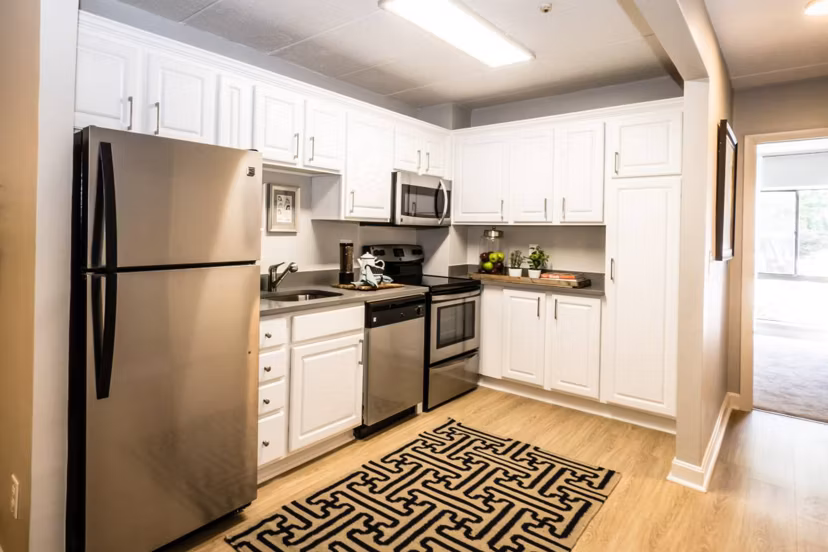 Spacious kitchen with modern appliances at Avana Weymouth Apartments